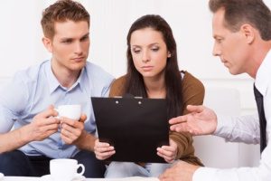 A group of people sitting around a table.